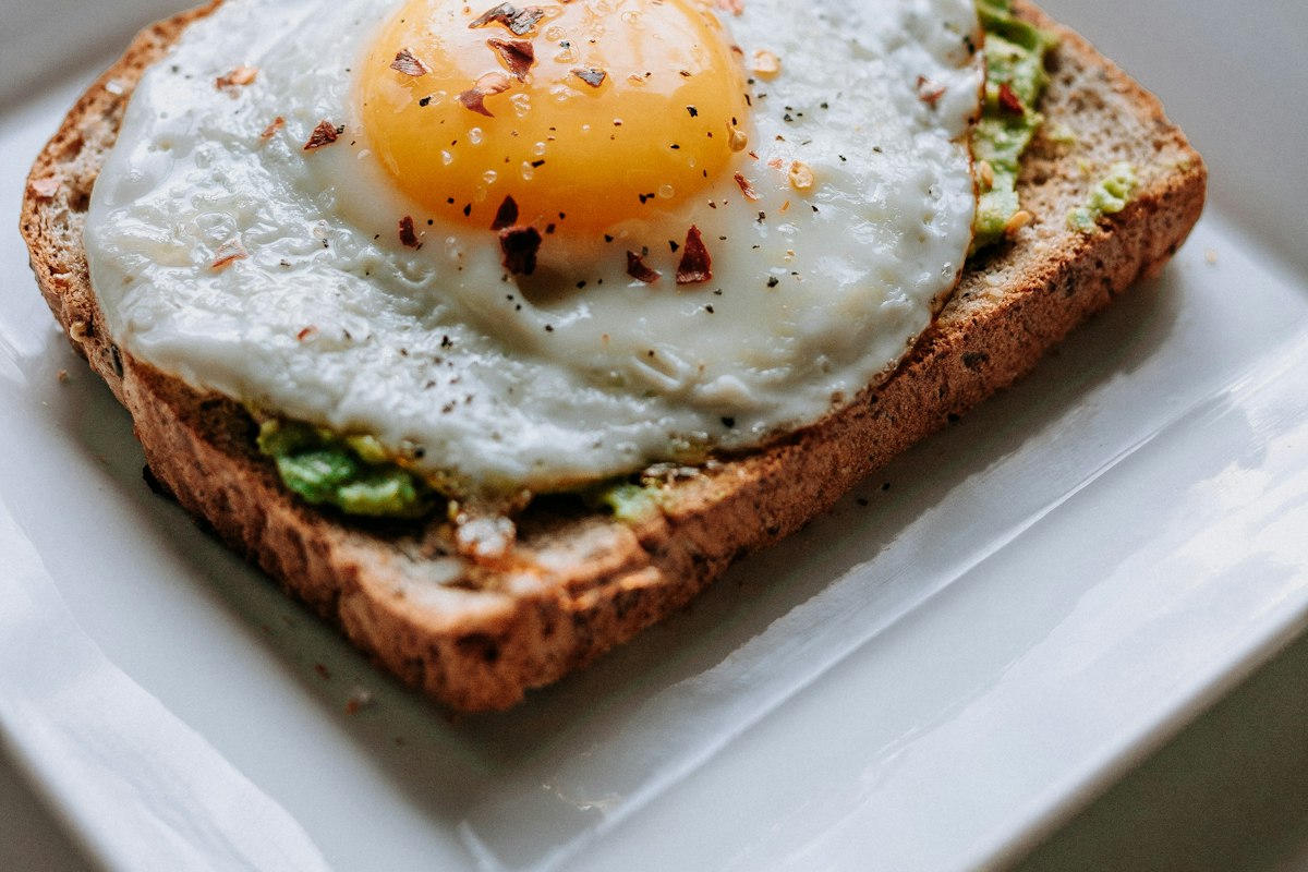 Fried egg and avocado on toasted sourdough, part of the brunch menu at Merchant of Venice Leicester