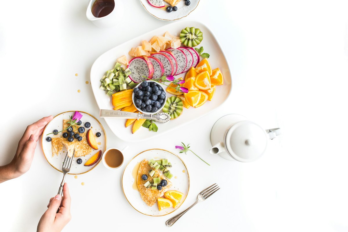 Weekend brunch table with waffles and coffee shared between friends at Merchant of Venice Leicester