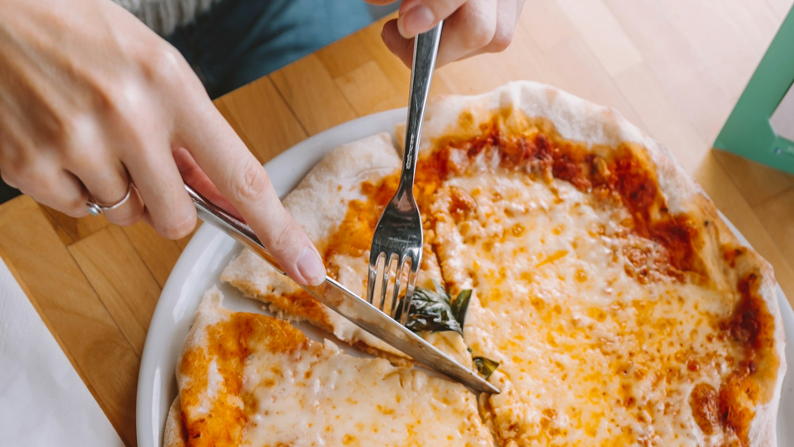 Sharing a pizza together, a family-friendly meal at Merchant of Venice Leicester