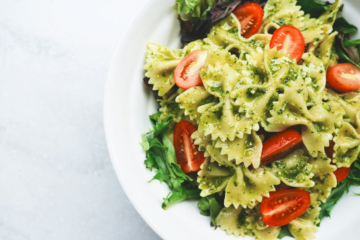 Fresh pesto pasta with cherry tomatoes, a vegetarian dish at Merchant of Venice Leicester
