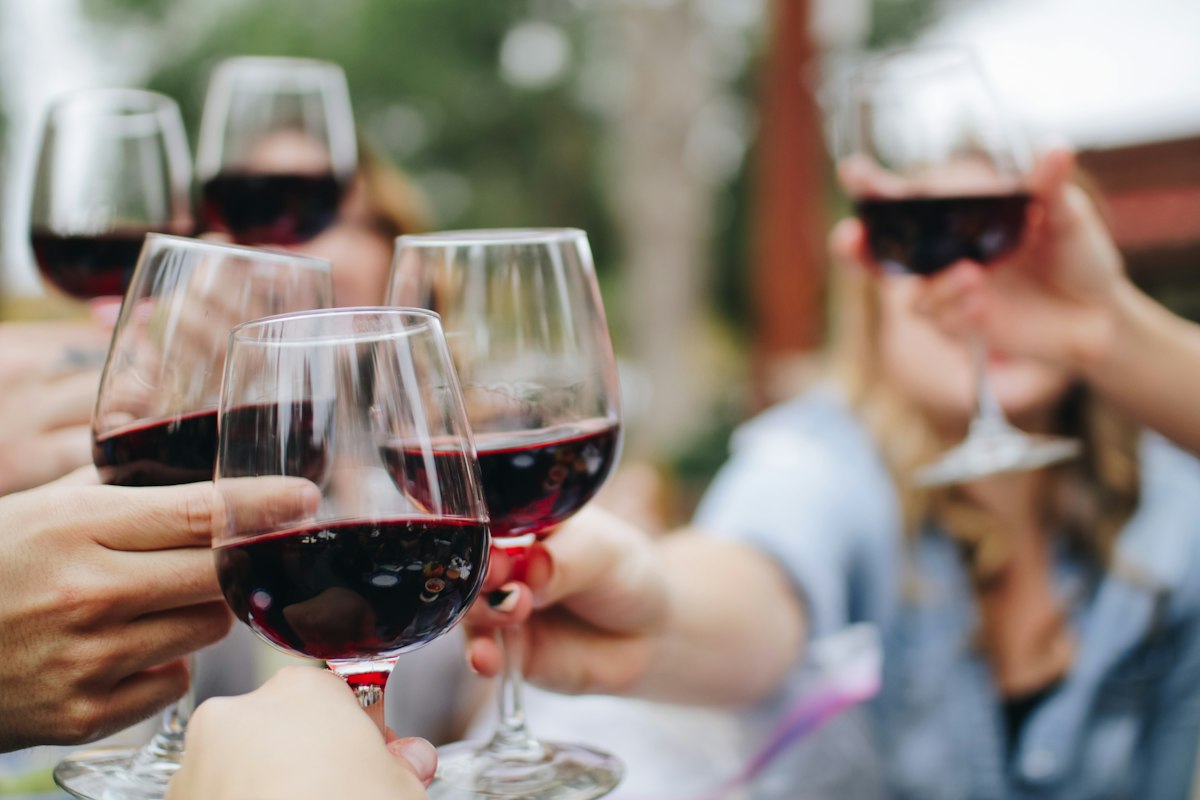 Small group toasting during a guided wine tasting evening at Merchant of Venice Leicester